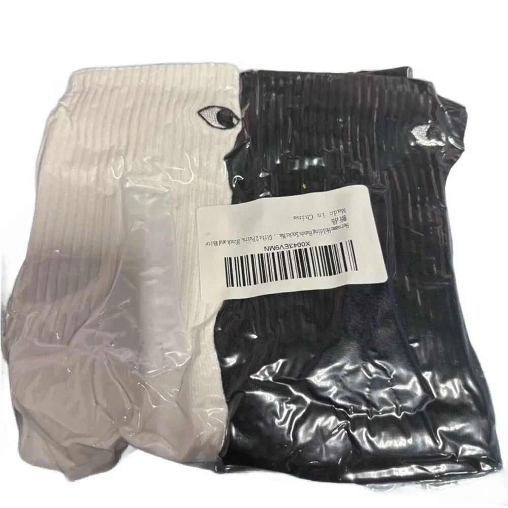NWT Two Pairs of eyes and ears or hands ladies white and black socks